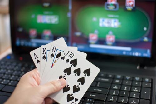 image of playing cards and online poker in the background